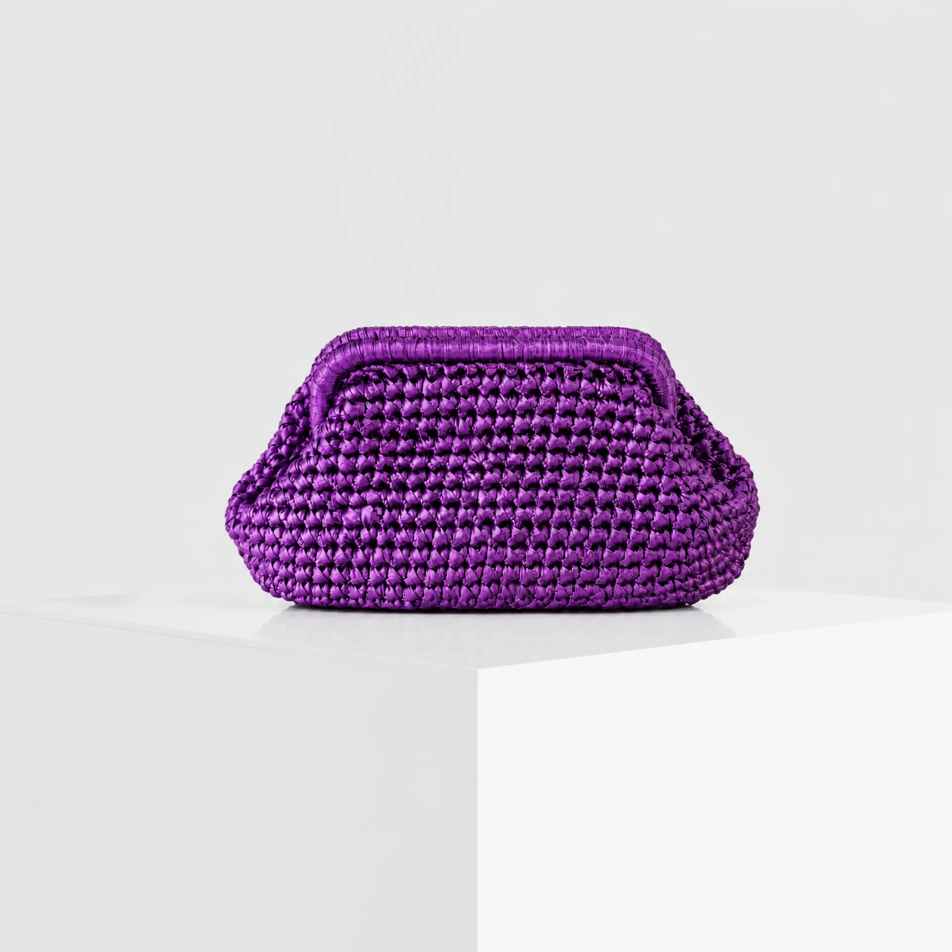 Hand-crocheted raffia cloud clutch in metallic violet
